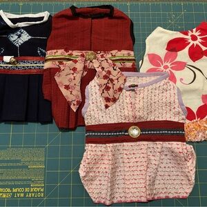 Assorted Dog Dresses with Floral and Patterned Designs